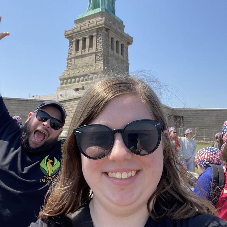 woman photobombed by man behind her