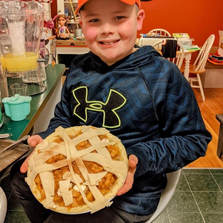 boy holding pie