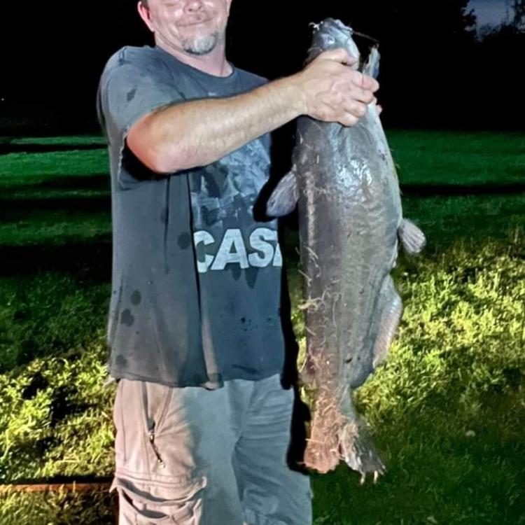 man holding big fish
