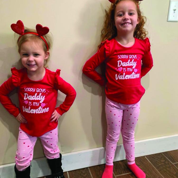 two little girls in heart headbands