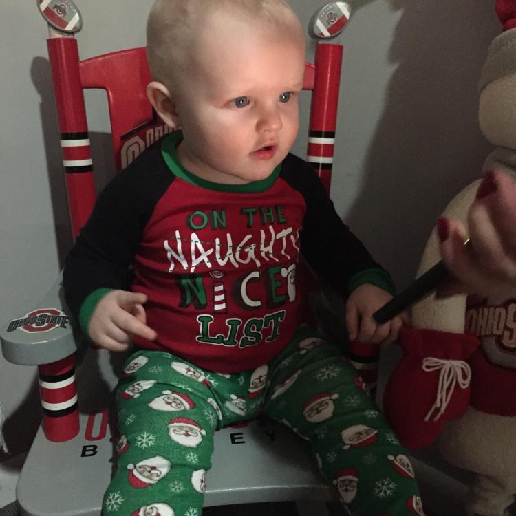 baby boy in Christmas pajamas