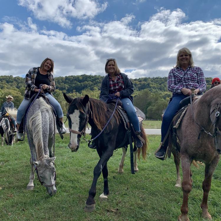 three women on horses