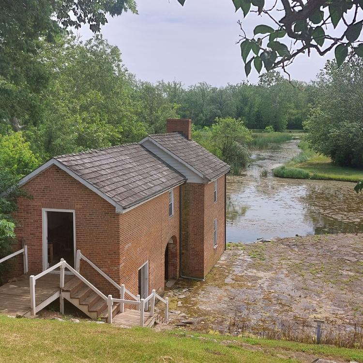 Small brown barn overlooking the canal