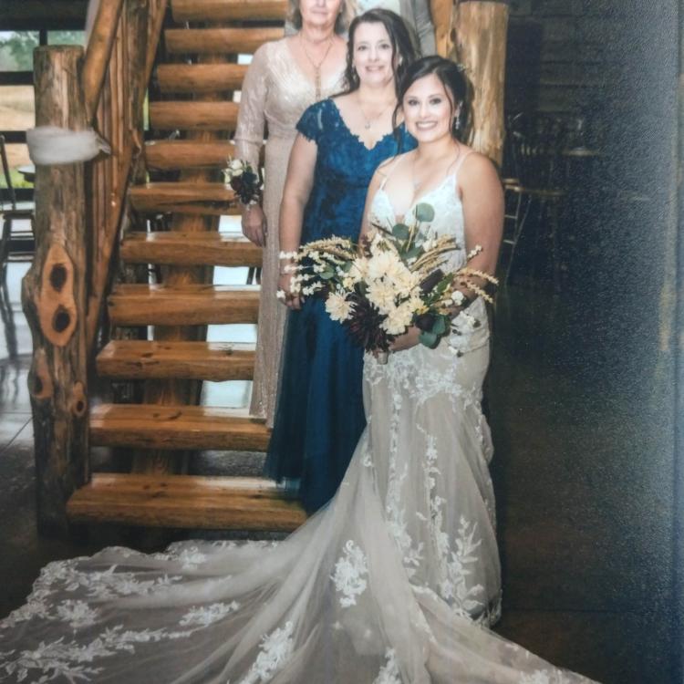 bride and three women on stairs