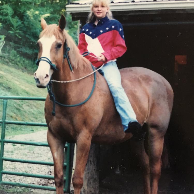 girl sitting bareback on horse