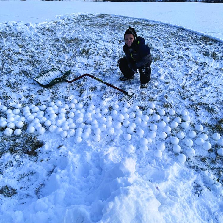 bundled up boy in snow