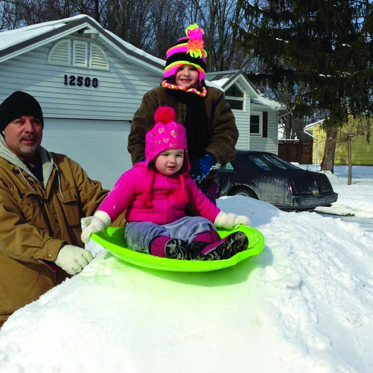 children on sleds