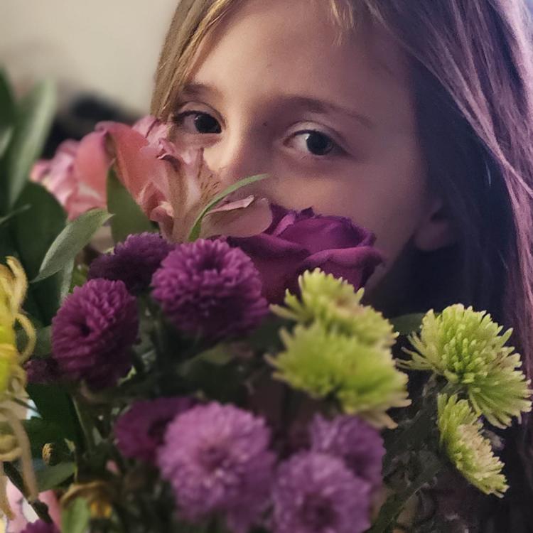 girl holding flowers