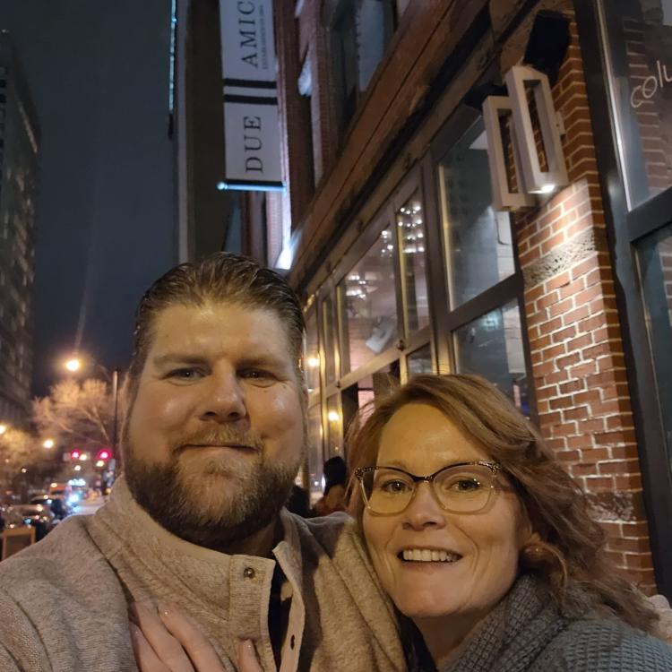 man and woman in front of restaurant