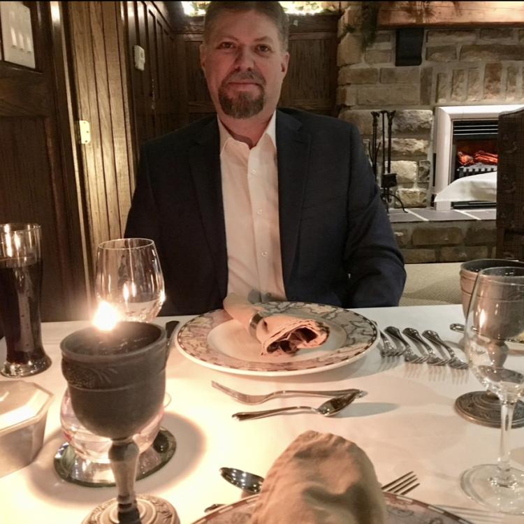 man at candlelit table