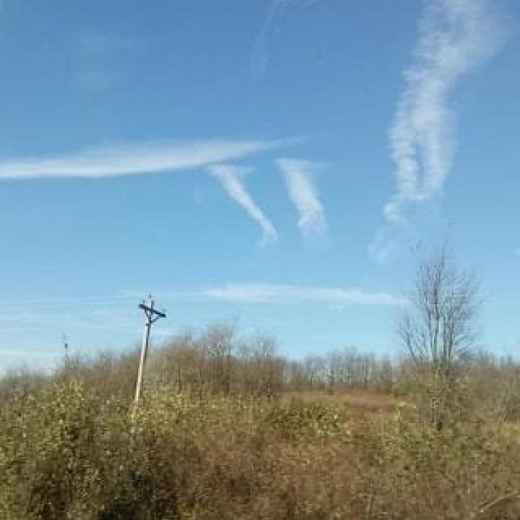 clouds form pi sign in sky