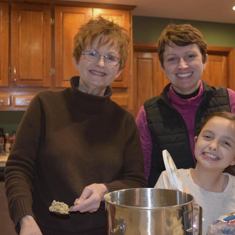 two women and a girl in a kitchen