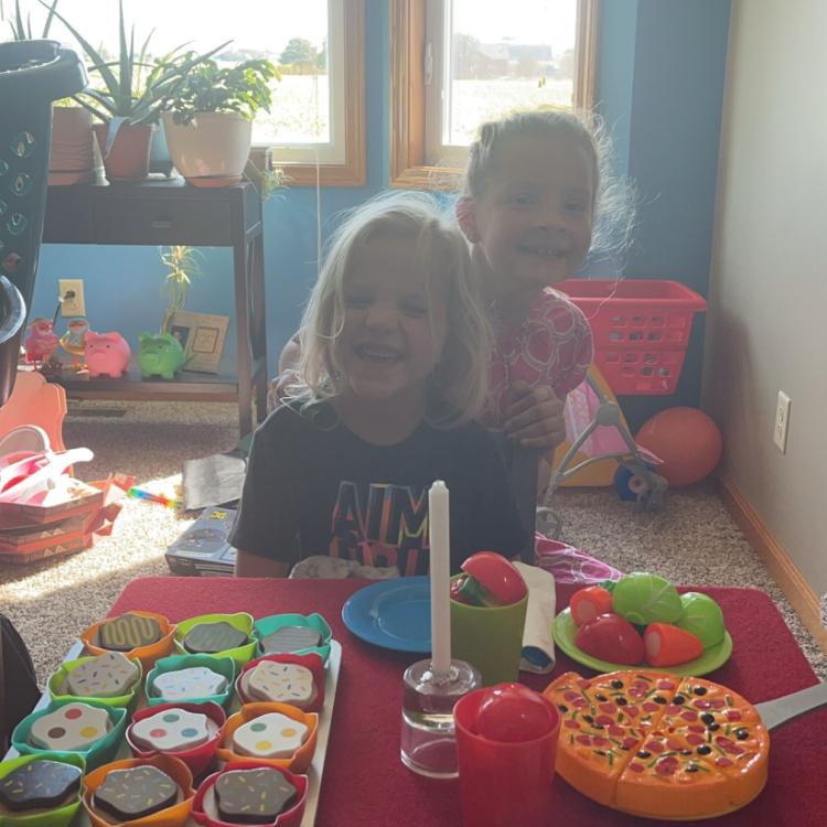 two little girls having tea party