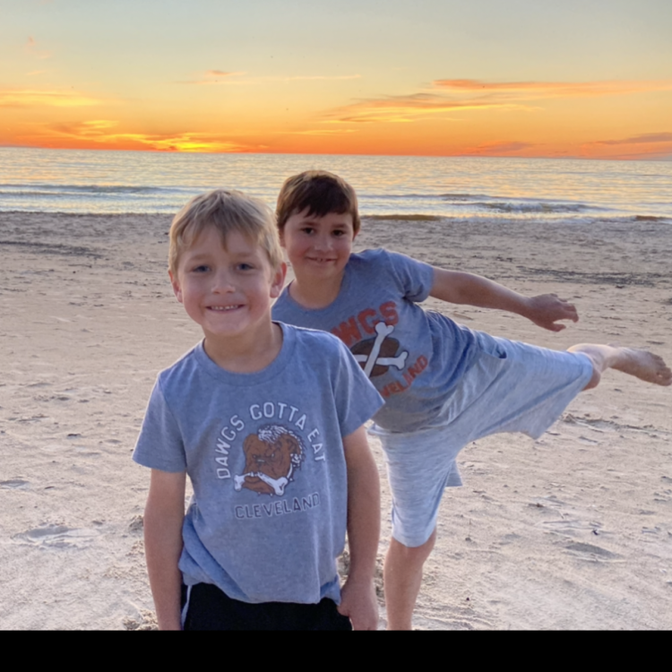 two boys on a sandy beach