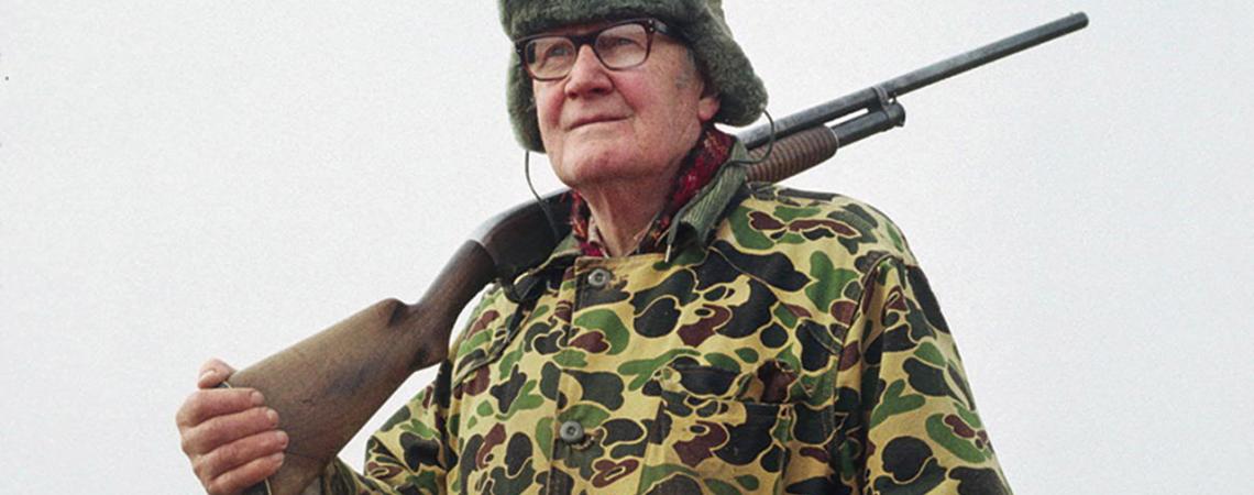 Merrill Gilfillan holding a hunting rifle