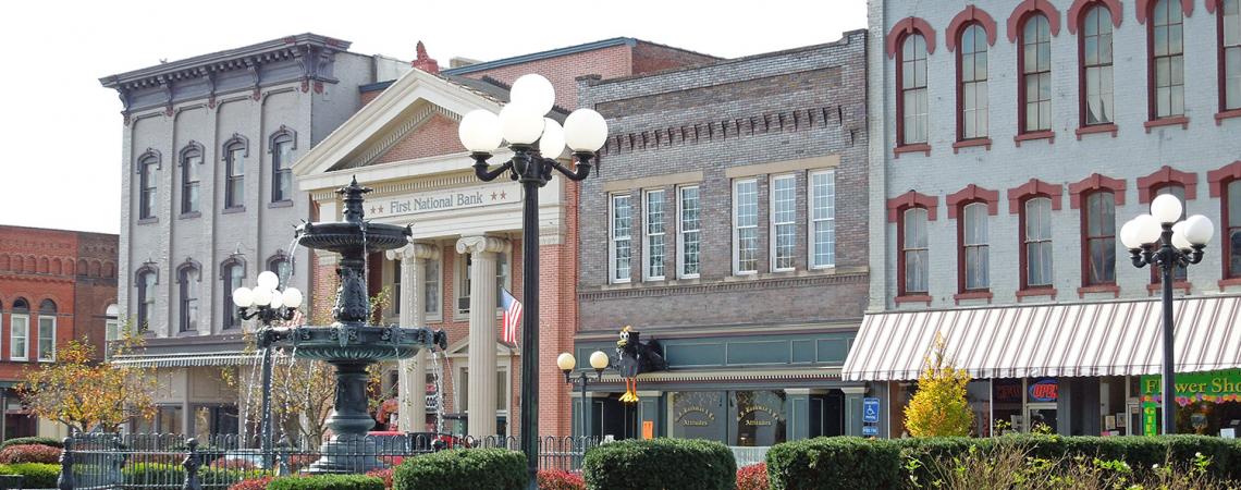 A picture of a fountain and buildings in Nelsonville