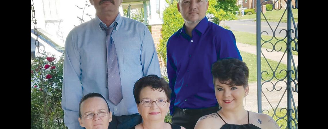 Chris Landers, top right, and his mother, Mary, bottom center, with his siblings and father last May. Landers, a lineman from Oklahoma, was killed on the job in 2017. (Photo courtesy of Mary Allison)