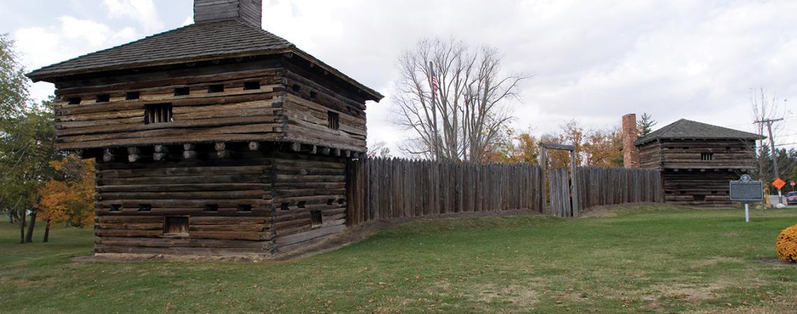 A picture of the wooden fort and fence of Fort Recovery.
