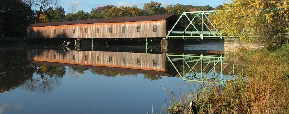 A landscape shot of Harpersfield Bridge above the water.