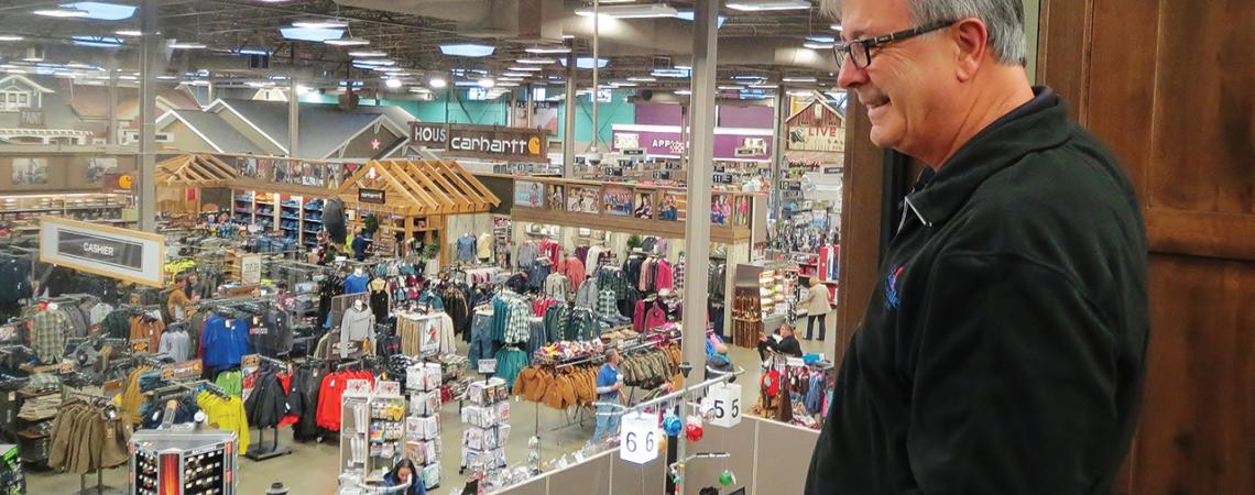Owner Howard Miller watches customers roam the floor of his hardware store in Hartville.