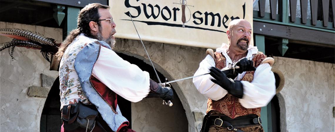 Two men re-create a duel with swords.