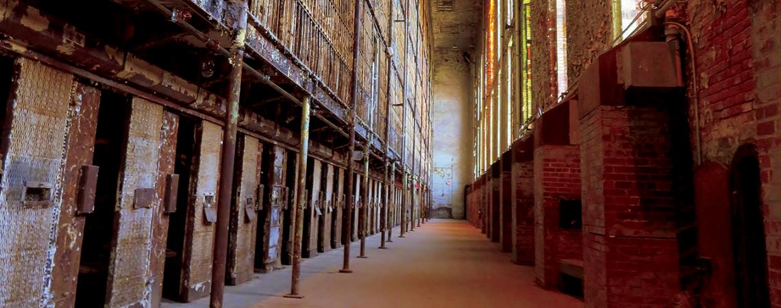 An inside view of the Ohio State Reformatory featuring old cells.