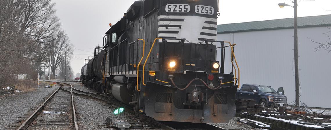 Engine 5255, a 100-ton locomotive, sits on the tracks.