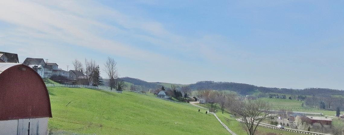 A photo of a barn and hill at Walnut Creek