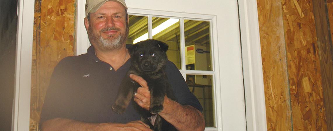 Man holding puppy
