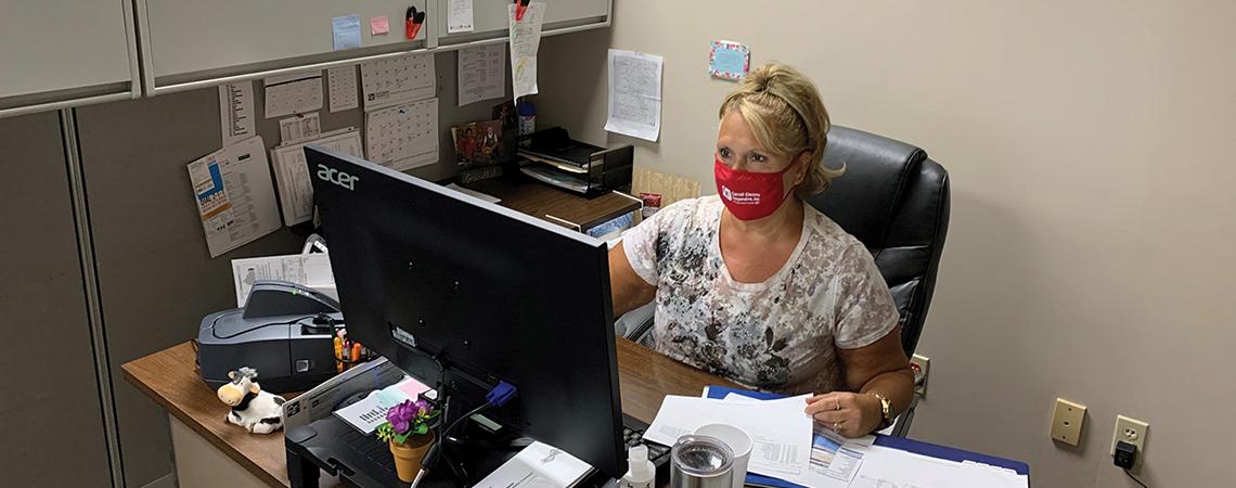 Co-op employee at desk