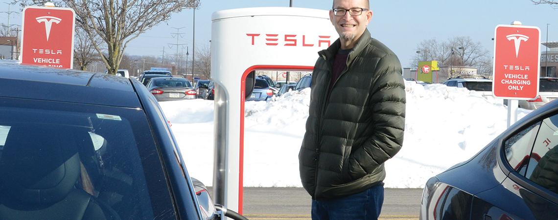 Jeff McCallister and an electric vehicle