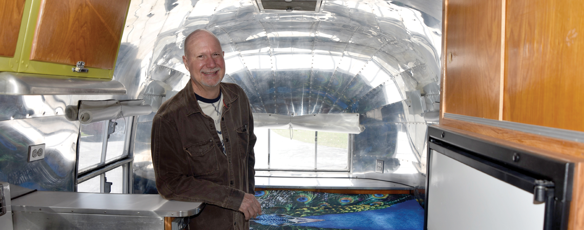 Jim Muncy inside his vintage Airstream