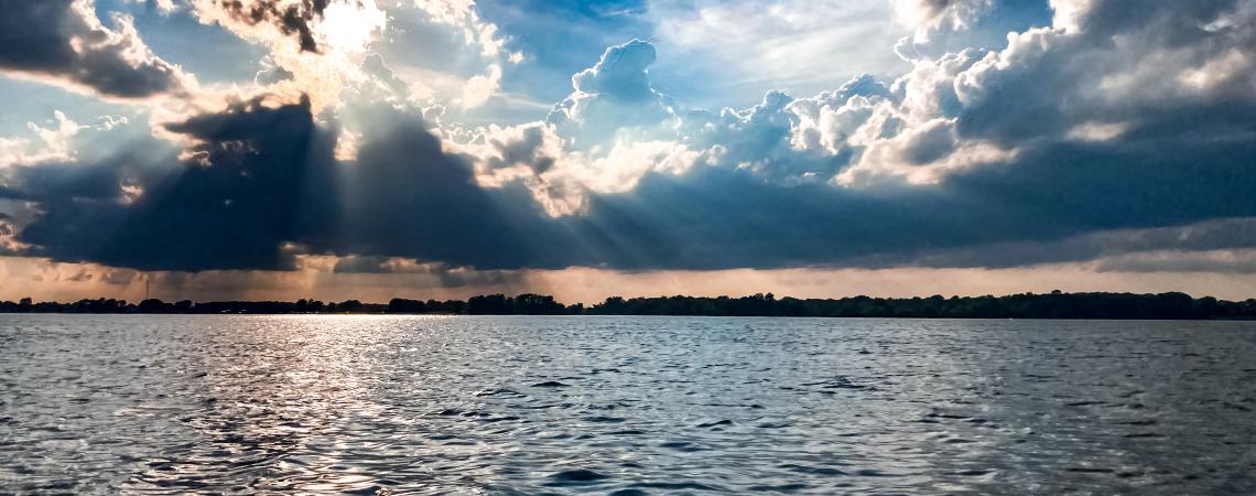 June - "Sun Shimmering on Indian Lake" by Gretchen Magoto