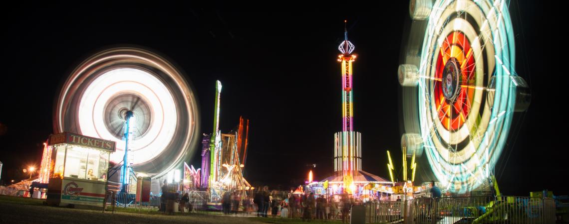 July - "Bright Lights at Sweet Corn Festival" by Ryan Maloney