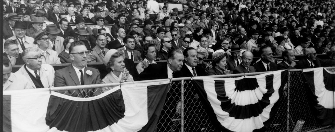 Bob Hope (front row, center) makes a face during opening day at Cleveland Municipal Stadium in 1964. Hope, who once was a co-owner of the Indians, also attended the final baseball game at the stadium in 1993 (photo courtesy of the Cleveland Guardians)