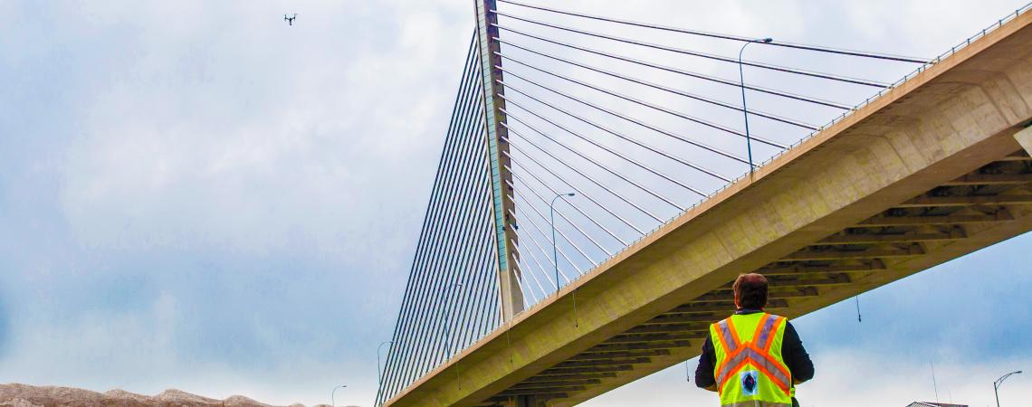 In this photo, pilot David Gallagher of ODOT’s Unmanned Aircraft Systems (UAS) prepares to inspect the Veterans Glass Bridge in Toledo (photo by Bruce Hull/courtesy of Ohio UAS Center).