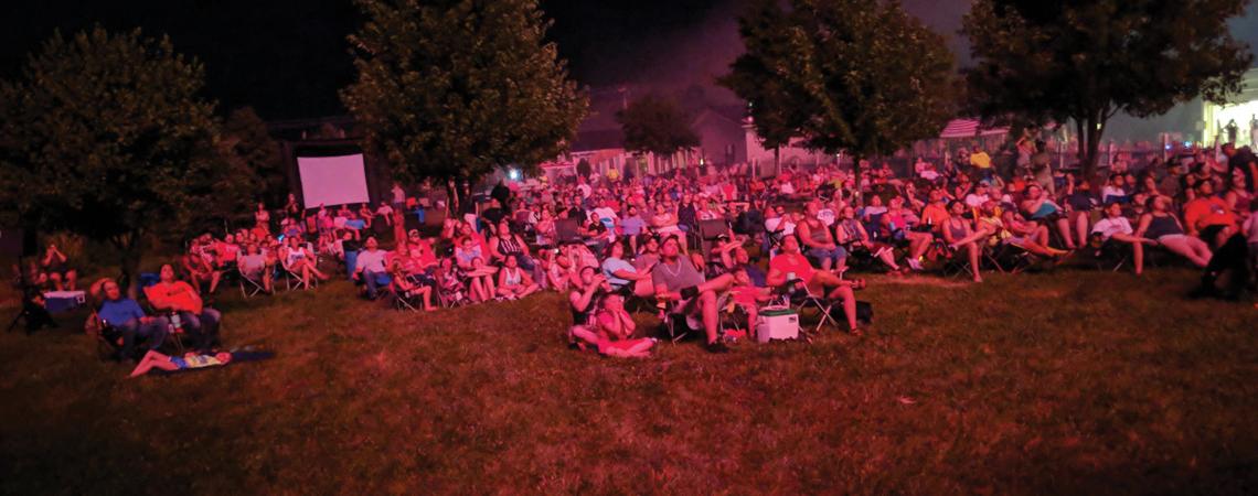 A crowd watching the fireworks show