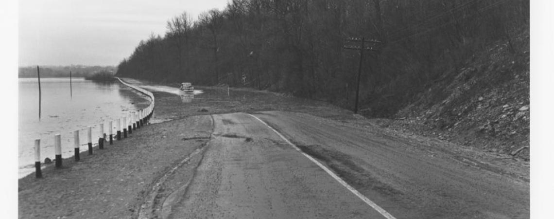 After the rains, a flooded road that led around the lake toward Reily (courtesy Reily Historical Society).