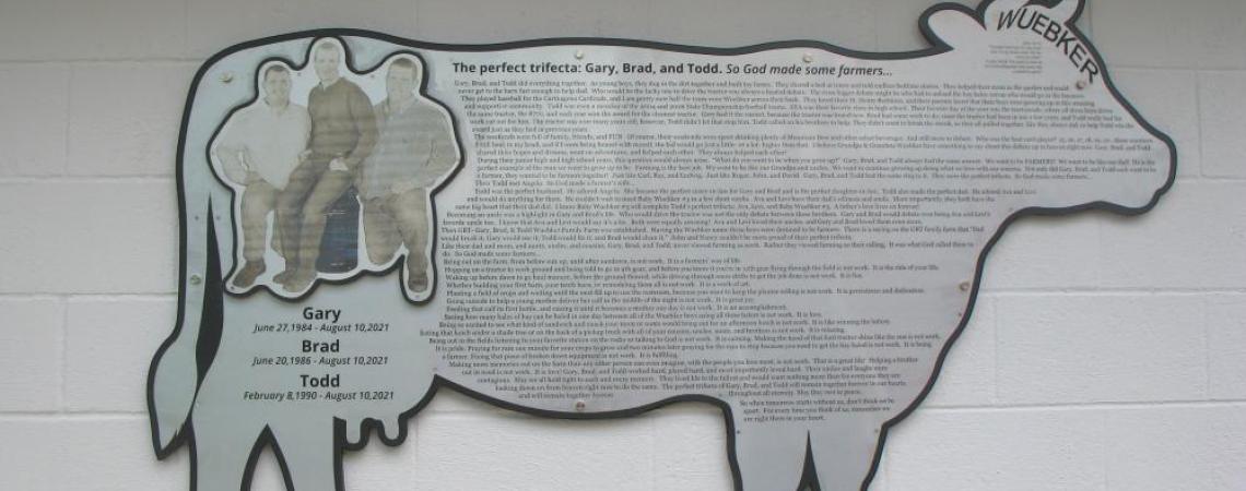 In the months since the 2022 dedication, a large cow-shaped plaque with a photo of the brothers has been mounted on the side of the enclosed picnic shelter.