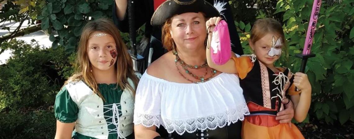Peggy Kelly (pictured at center) attends the Ohio Renaissance Festival both alone and with her family during the course of the event. 