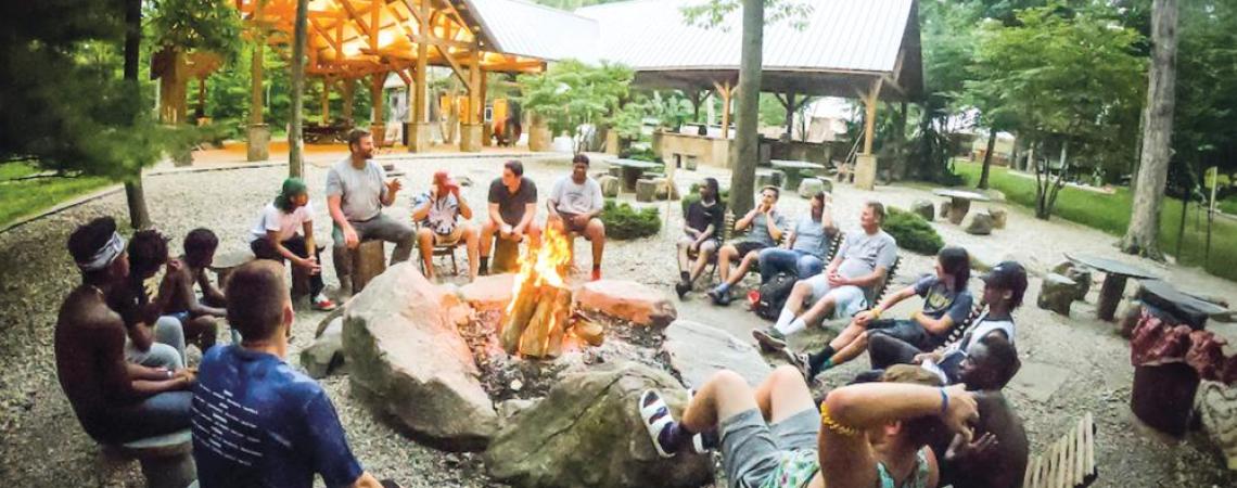 Campers and staffers gather at the firepit by Camp Chenoweth’s pavilion for fellowship and relaxation.