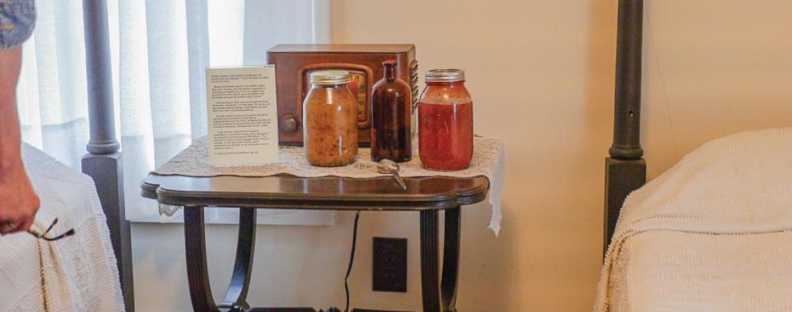 The original concoction created to sober up houseguests — sauerkraut, tomatoes, and Karo syrup — is displayed in one of the bedrooms in Dr. Bob's House.