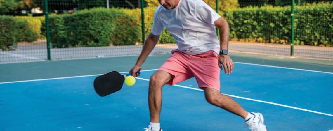 A pickleball player on the court. 