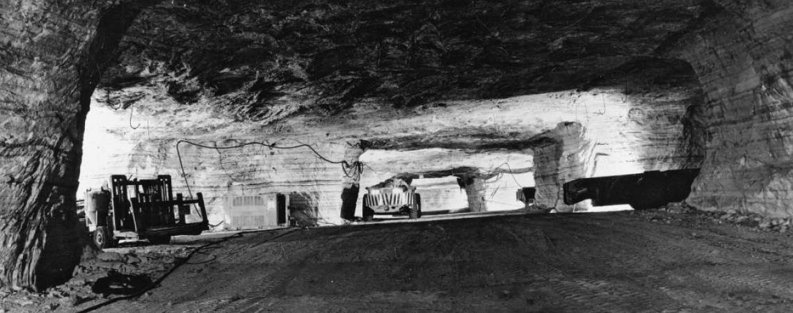 Miners using the room and pillar technique to remove salt from a mine.