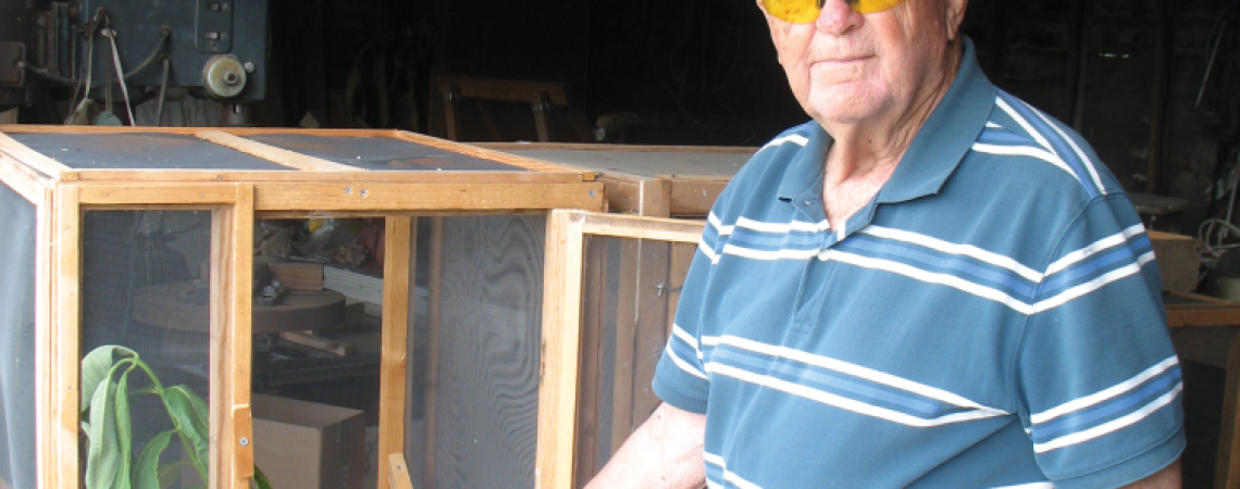 Alvin Brown of New Bremen displays his homemade butterfly box. 