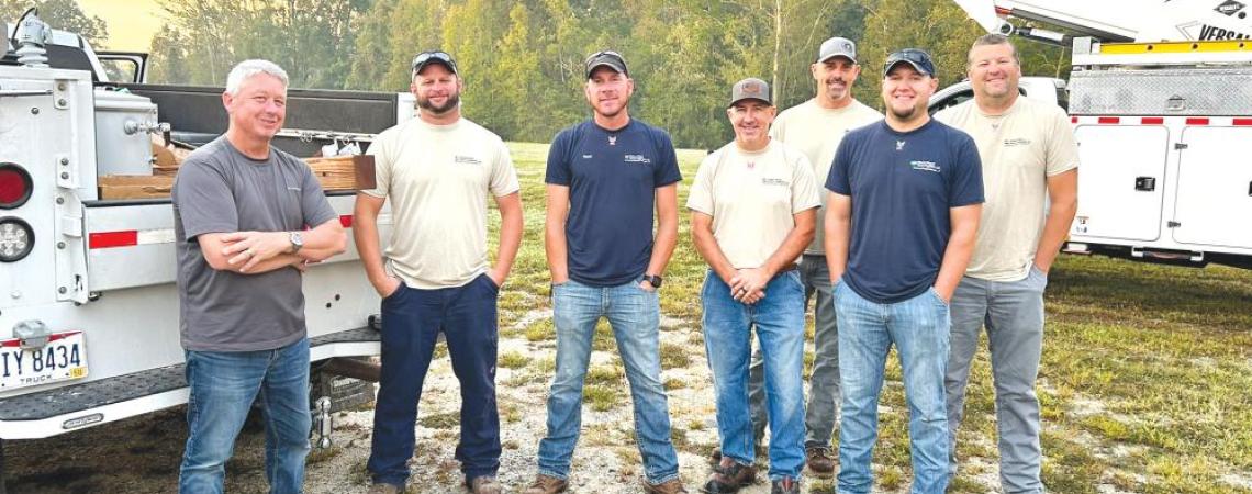 Greg Young from Laurens Electric Cooperative in South Carolina (left) worked with Matt Morris, Mike Rowe, Steve Asbury, Josh Johnson, Sean Stewart, and Bowe Firebaugh from Holmes-Wayne Electric Cooperative in their restoration work.