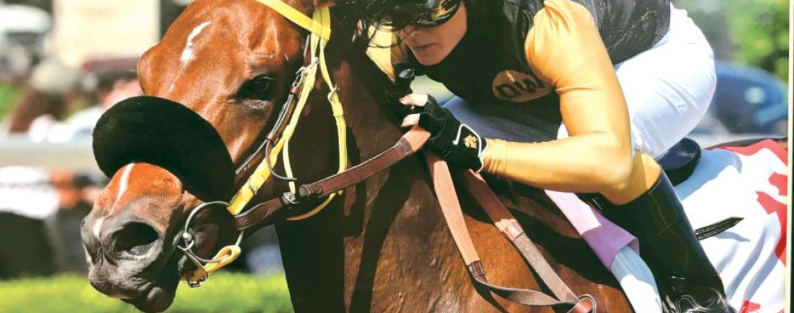 Chelsey Kelser atop a Thoroughbred