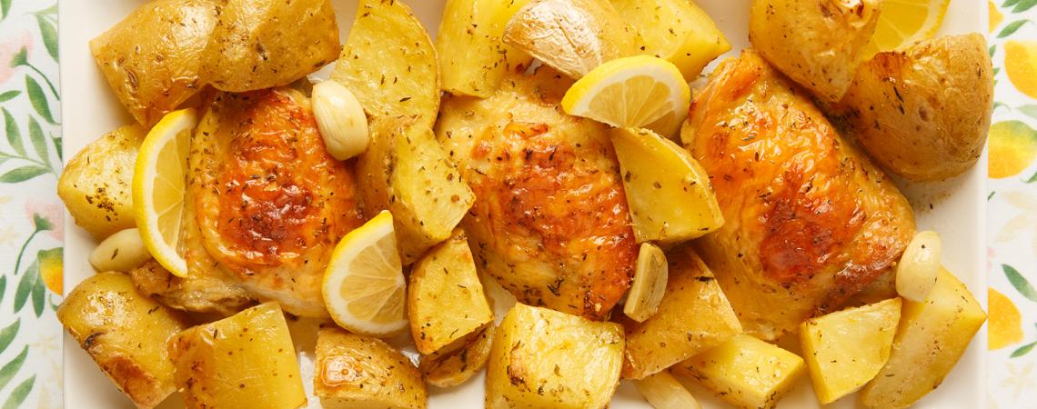 A plate of potatoes and chicken