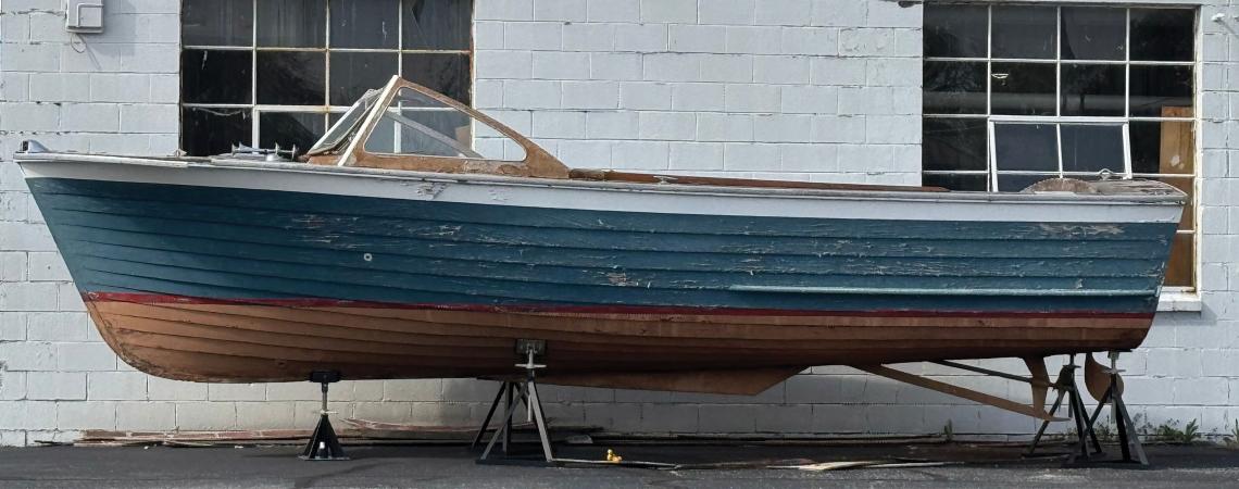A Lyman boat sitting outside