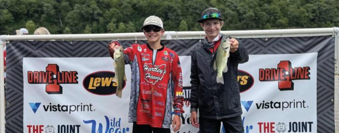 Two young fishermen at a fishing competition